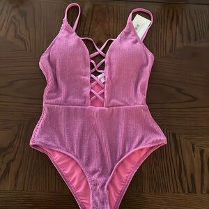 Medium, new with tags and never worn